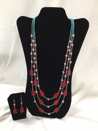 Three strand necklace is dedicated to Indigenous women everywhere, they are highlighted by silver metal beads and red accent beads, the set is completed with matching drop earrings.   The shortest strand is 28